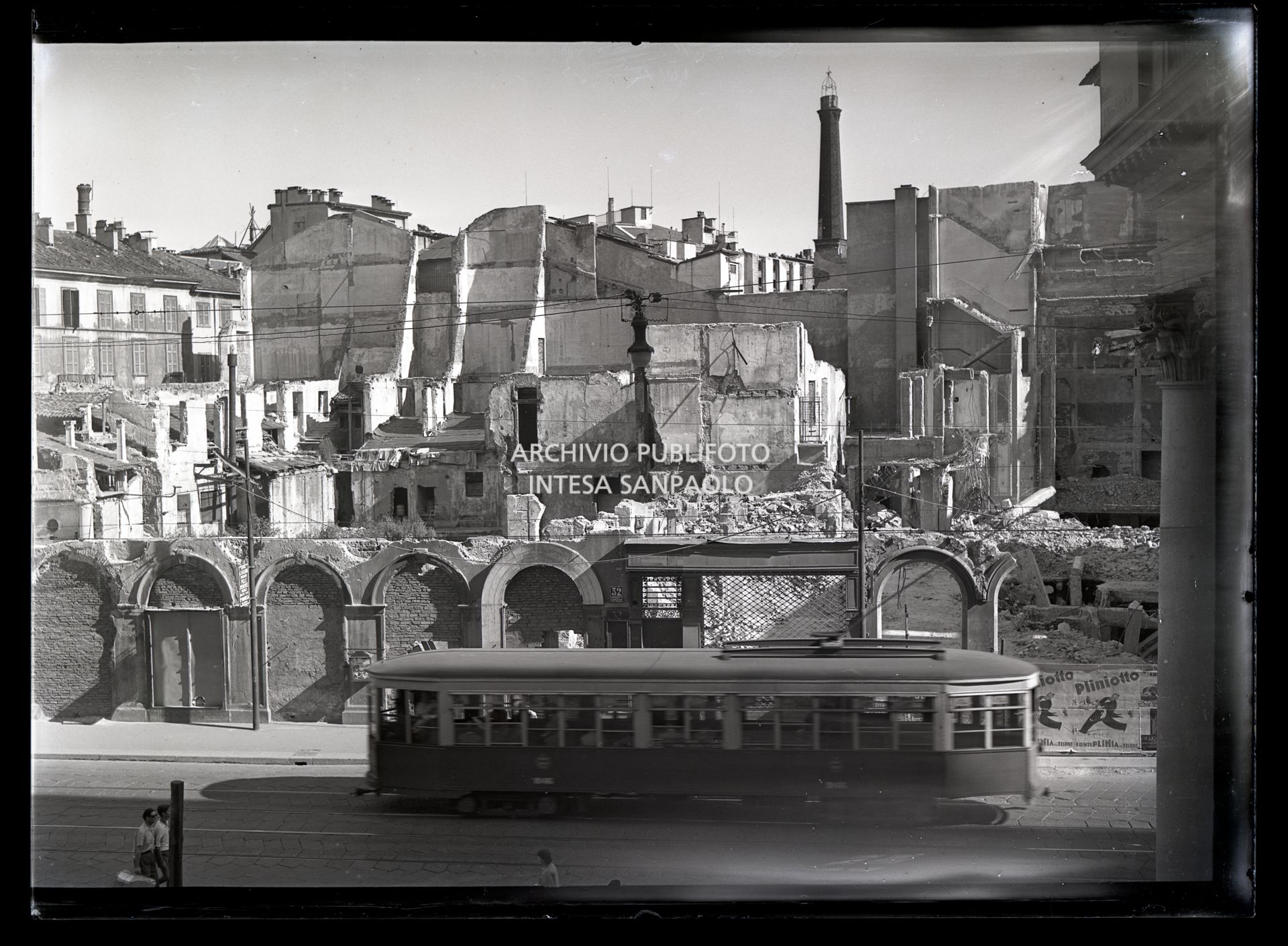 A tram in corso Vittorio Emanuele II in Milan in front of buildings damaged by bombing in 1943