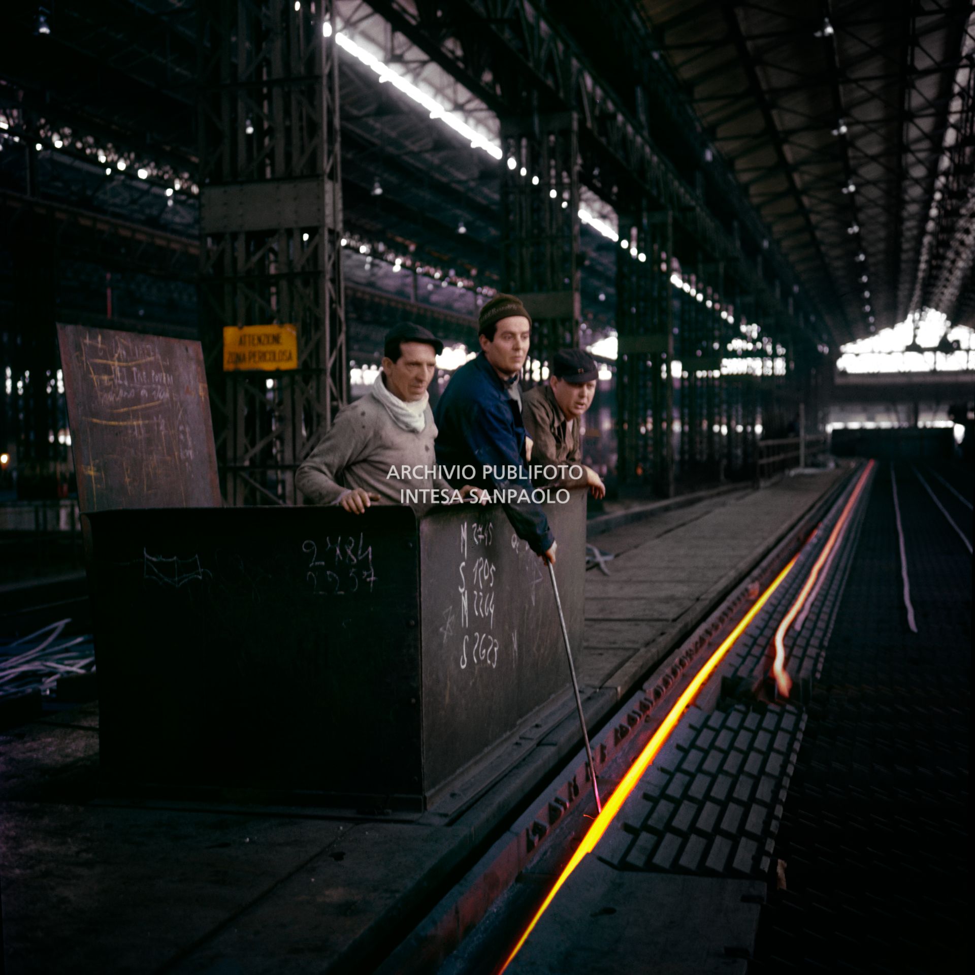 Workers in the Finsider iron and steel plant