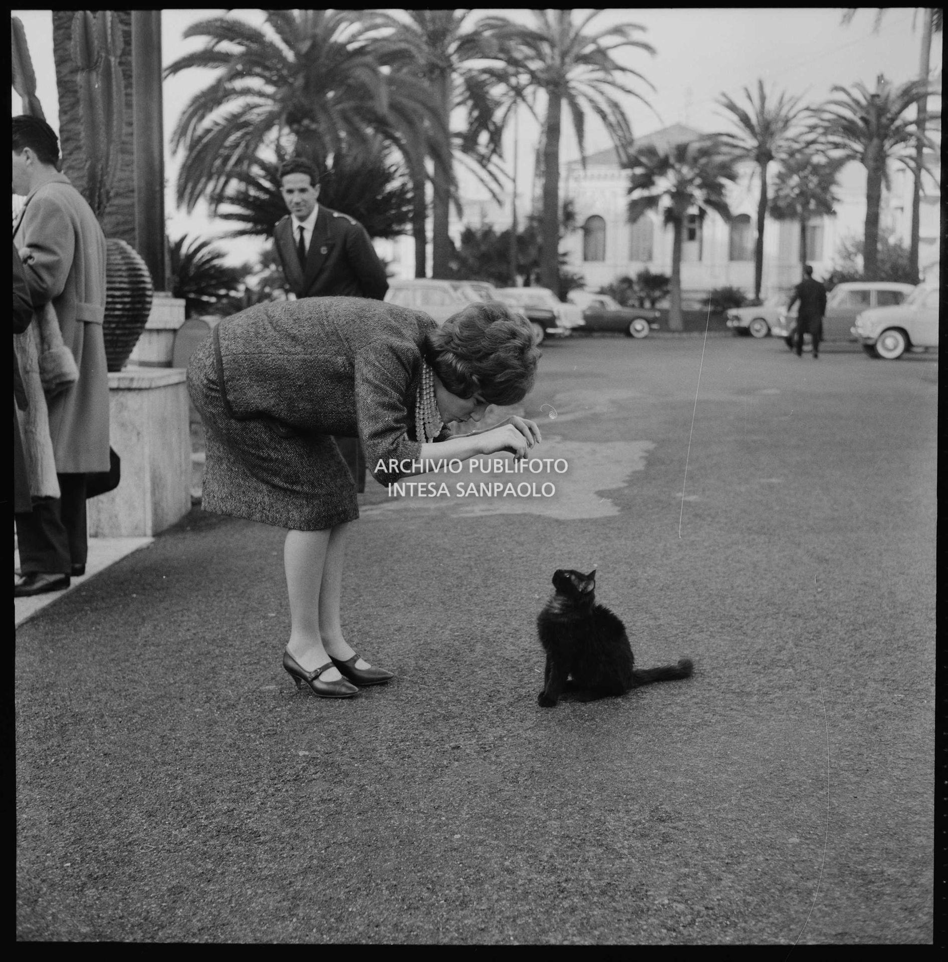 Jolanda Rossin plays with a cat in Sanremo during the 11th Festival