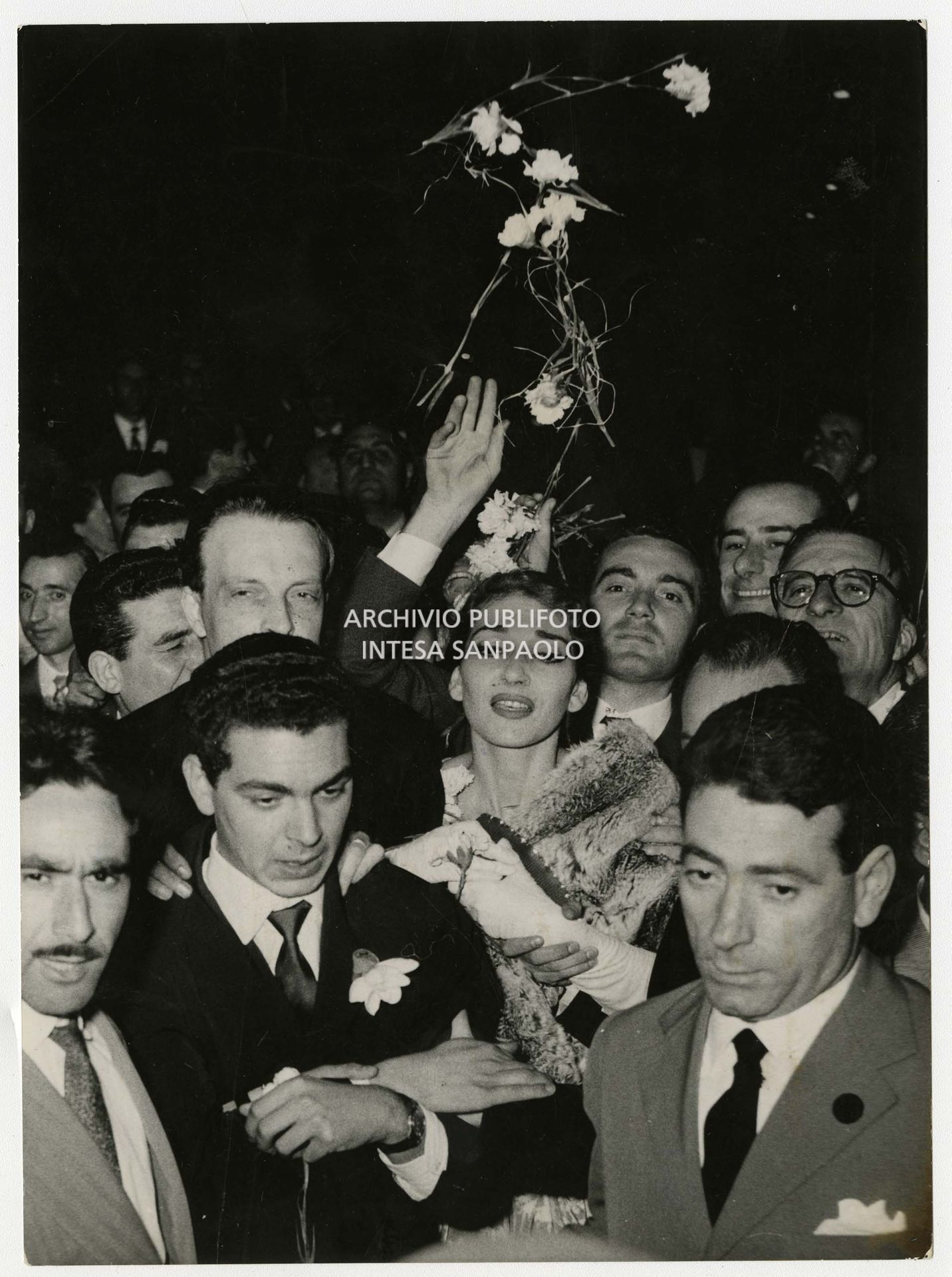 Maria Callas surrounded by admirers at the end of her "last" appearance at La Scala, where she performed Vincenzo Bellini's Il Pirata.