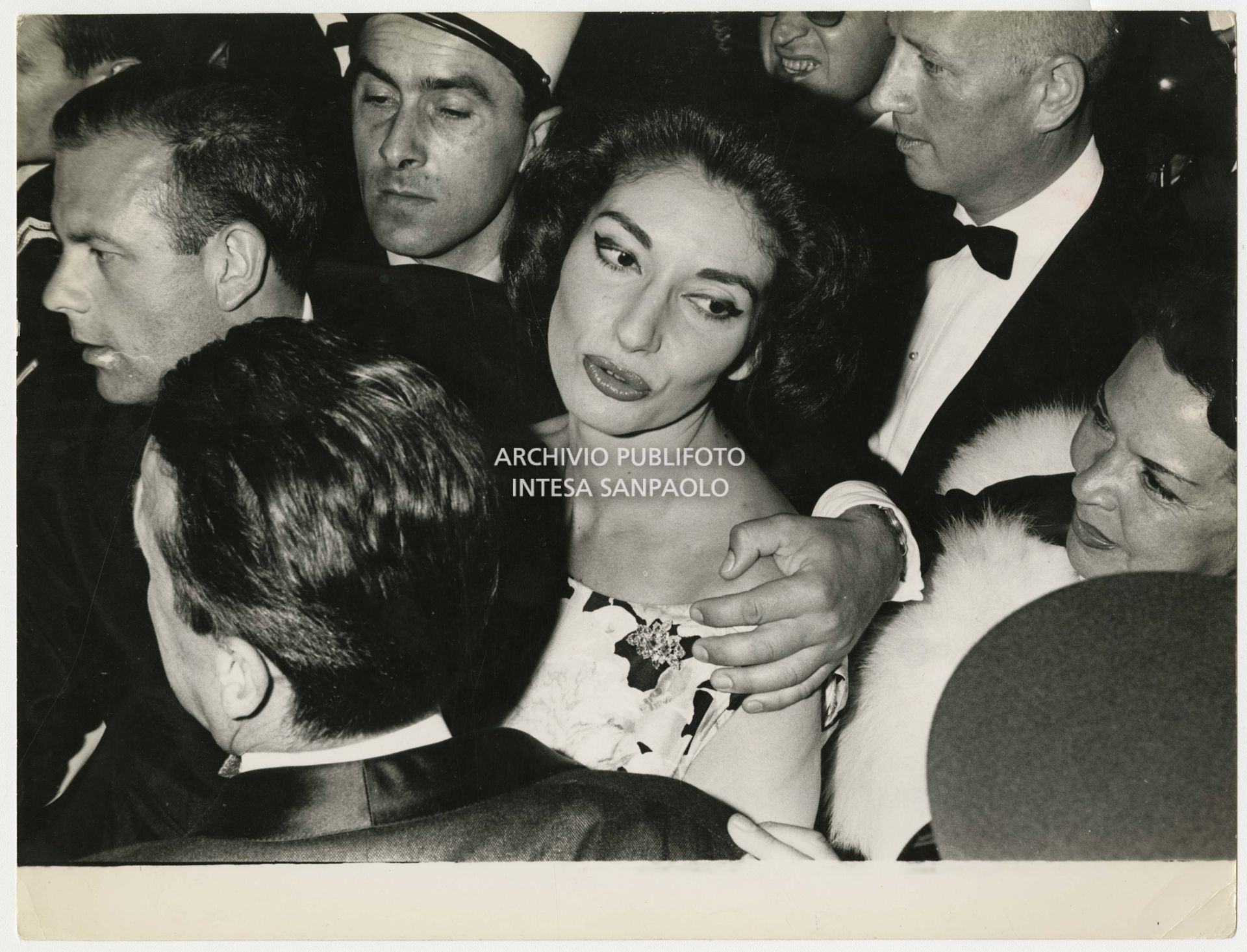 Maria Callas surrounded by the crowd at the Cannes Film Festival