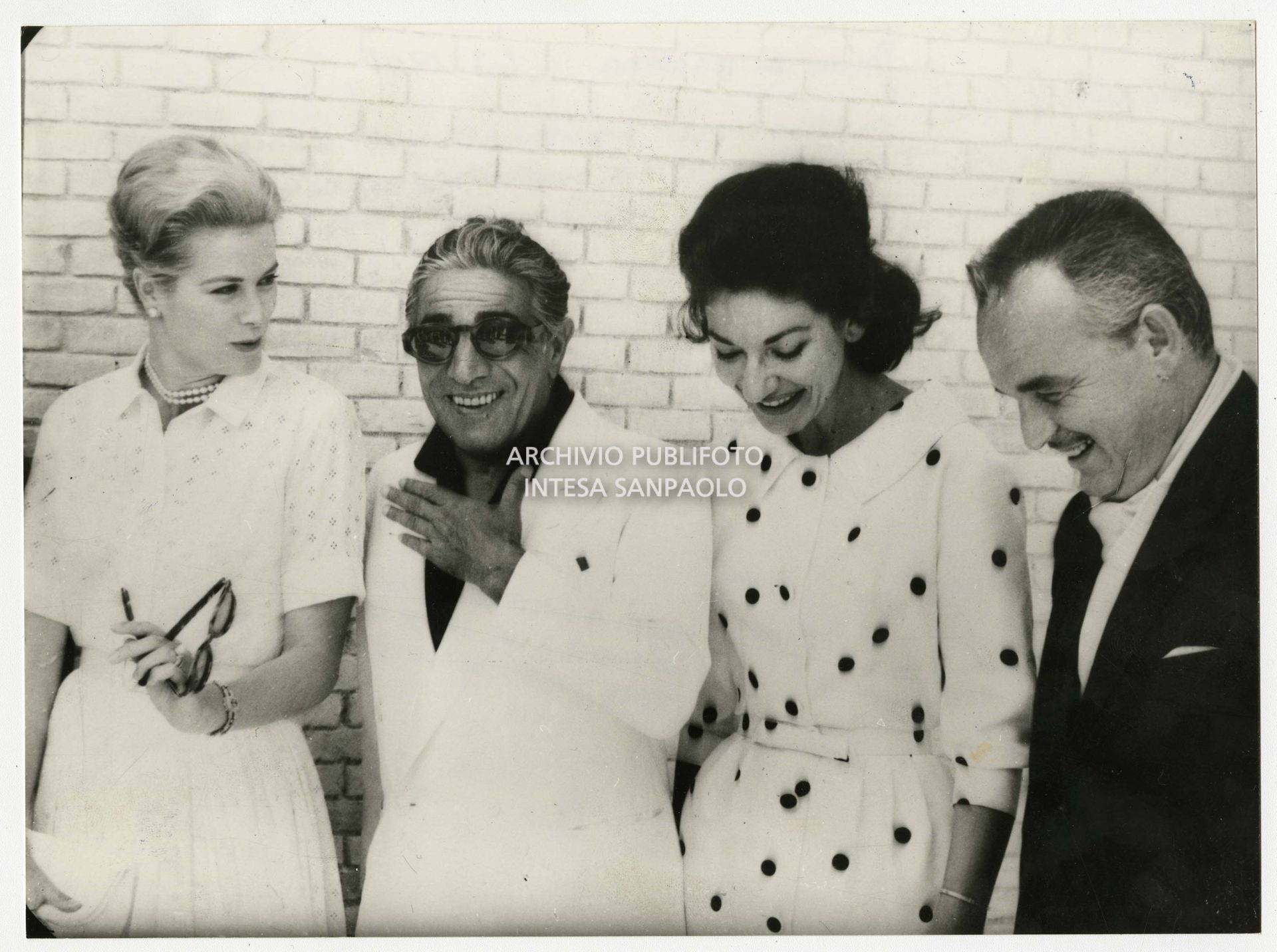 Maria Callas, Aristotele Onassis, Grace Kelly and Prince Rainier III of Monaco at the Hotel San Vida in Palma de Mallorca where they stopped during a Mediterranean cruise on board the yacht "Christina"