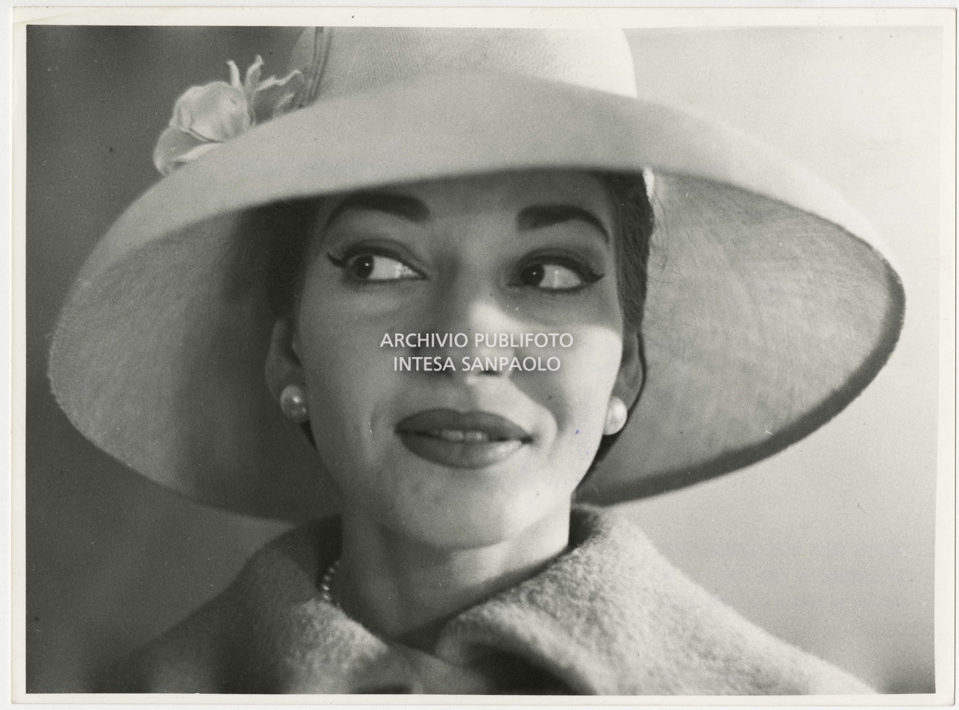 Maria Callas pictured in her home, dressed by Biki