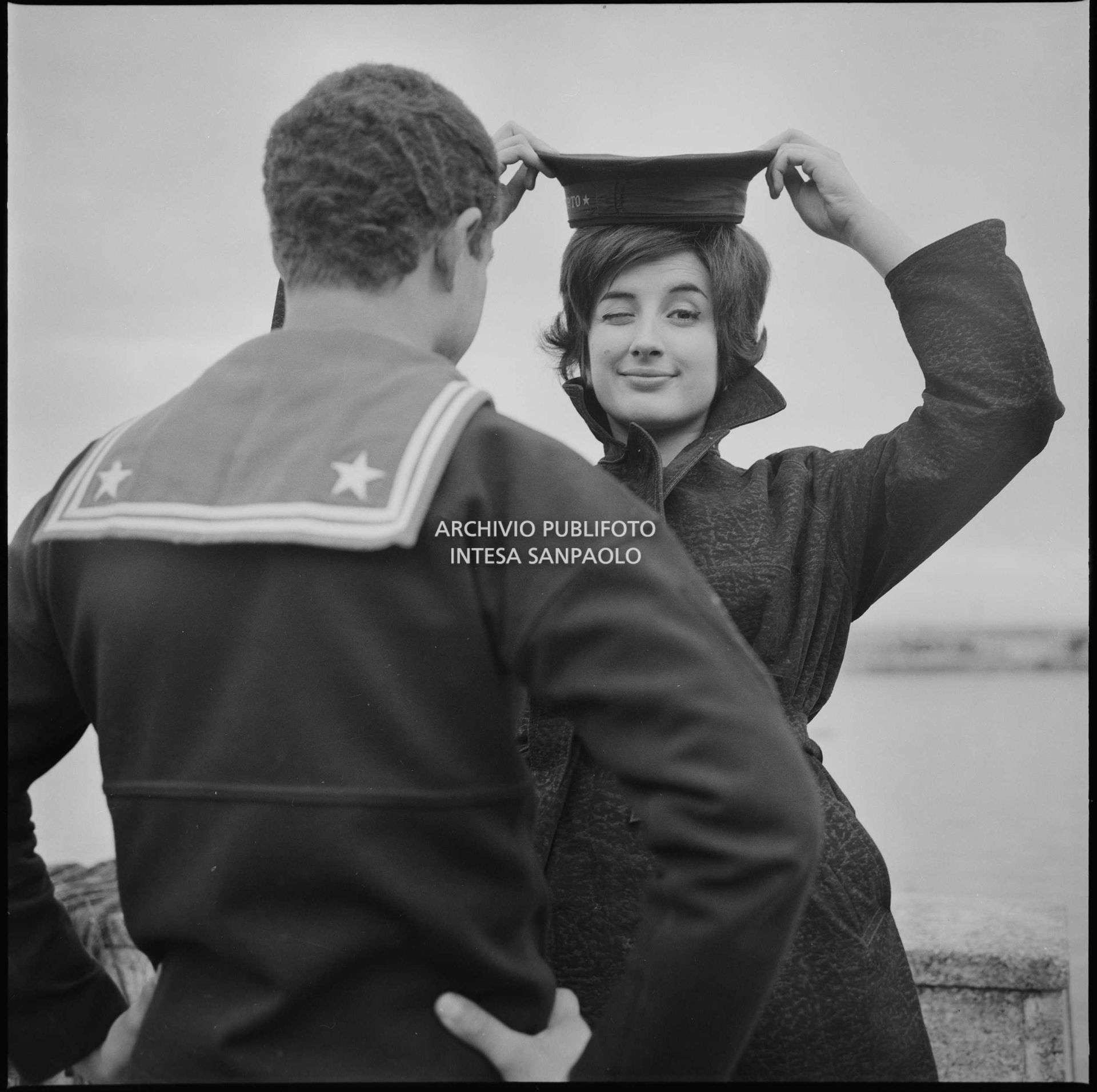 Mina wearing a sailor's cap at the port of Sanremo during the 10th Festival