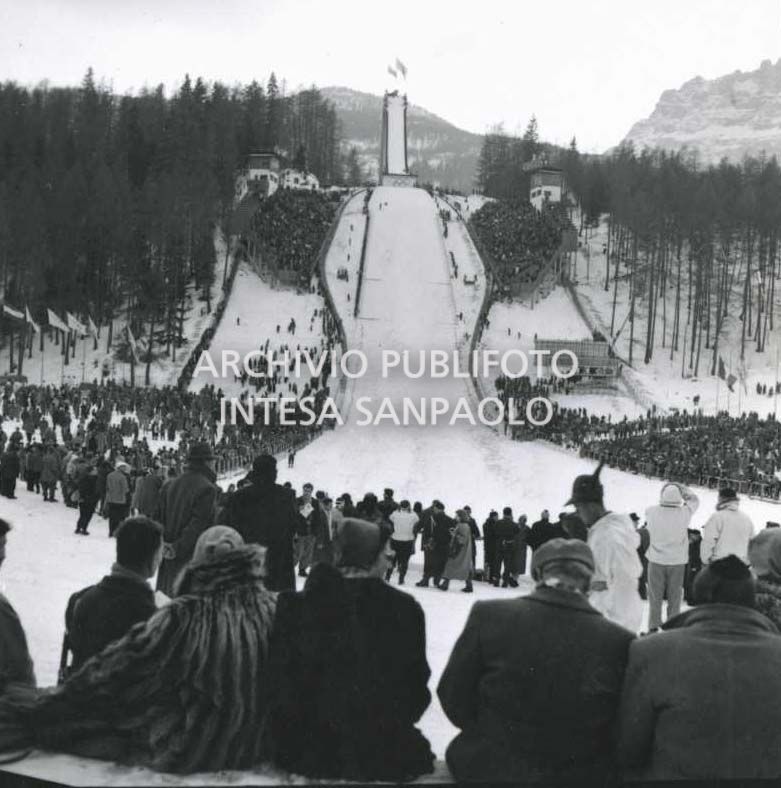 Spectators watching a ski jumping competition at the Trampolino Italia ski jump