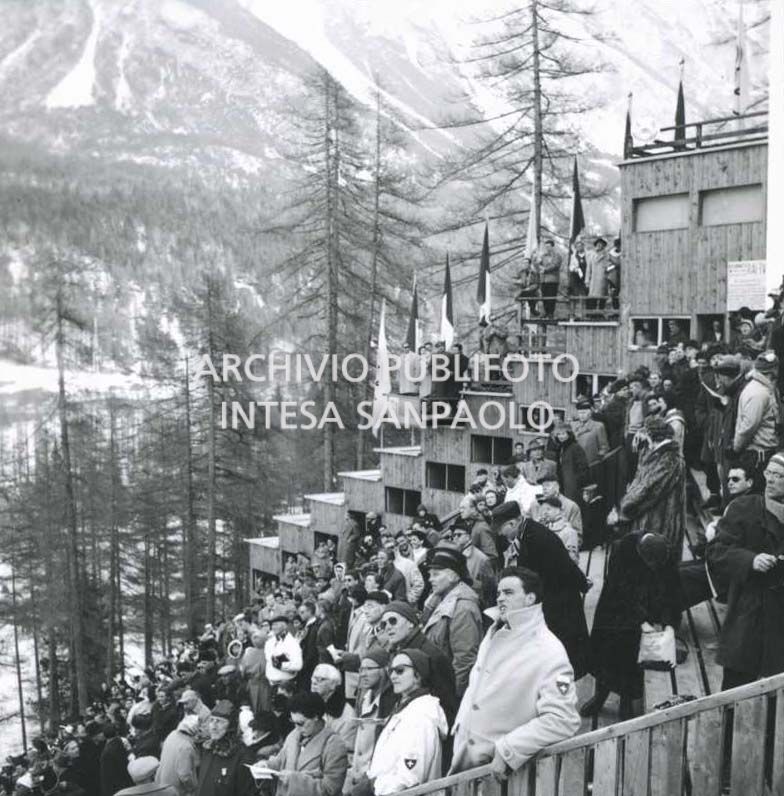 Spectators watching a ski jumping competition at the Trampolino Italia ski jump